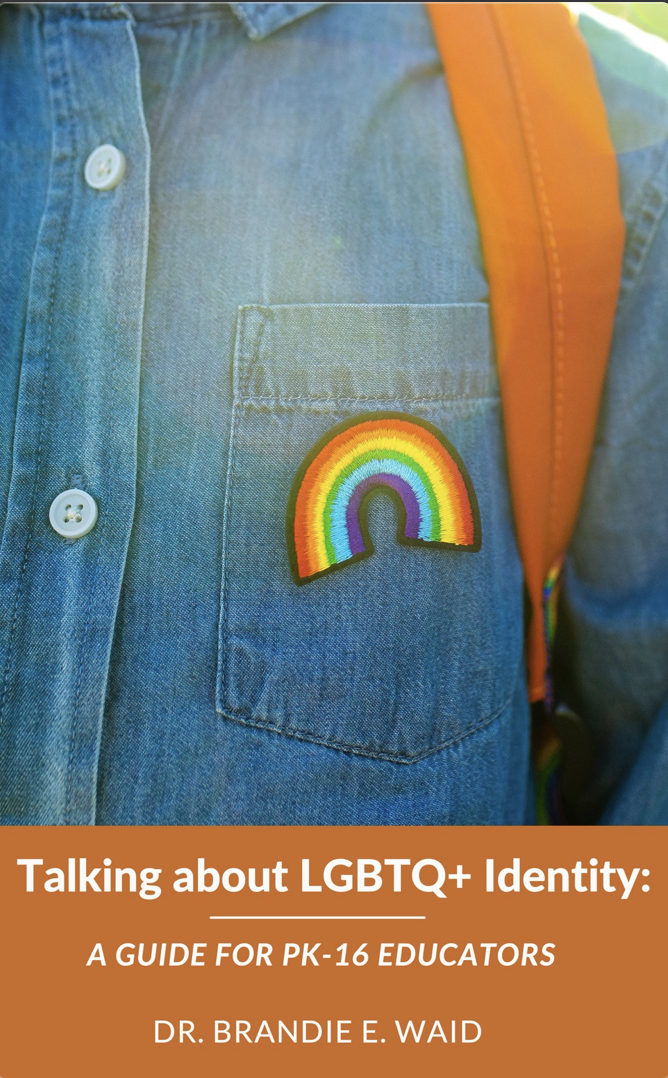 Image of Brandie's Guide "Talking about LGBTQ+ Identity". The cover shows the front right pocket of someones button up denim shirt. There is a rainbow patch stitched on the pocket.